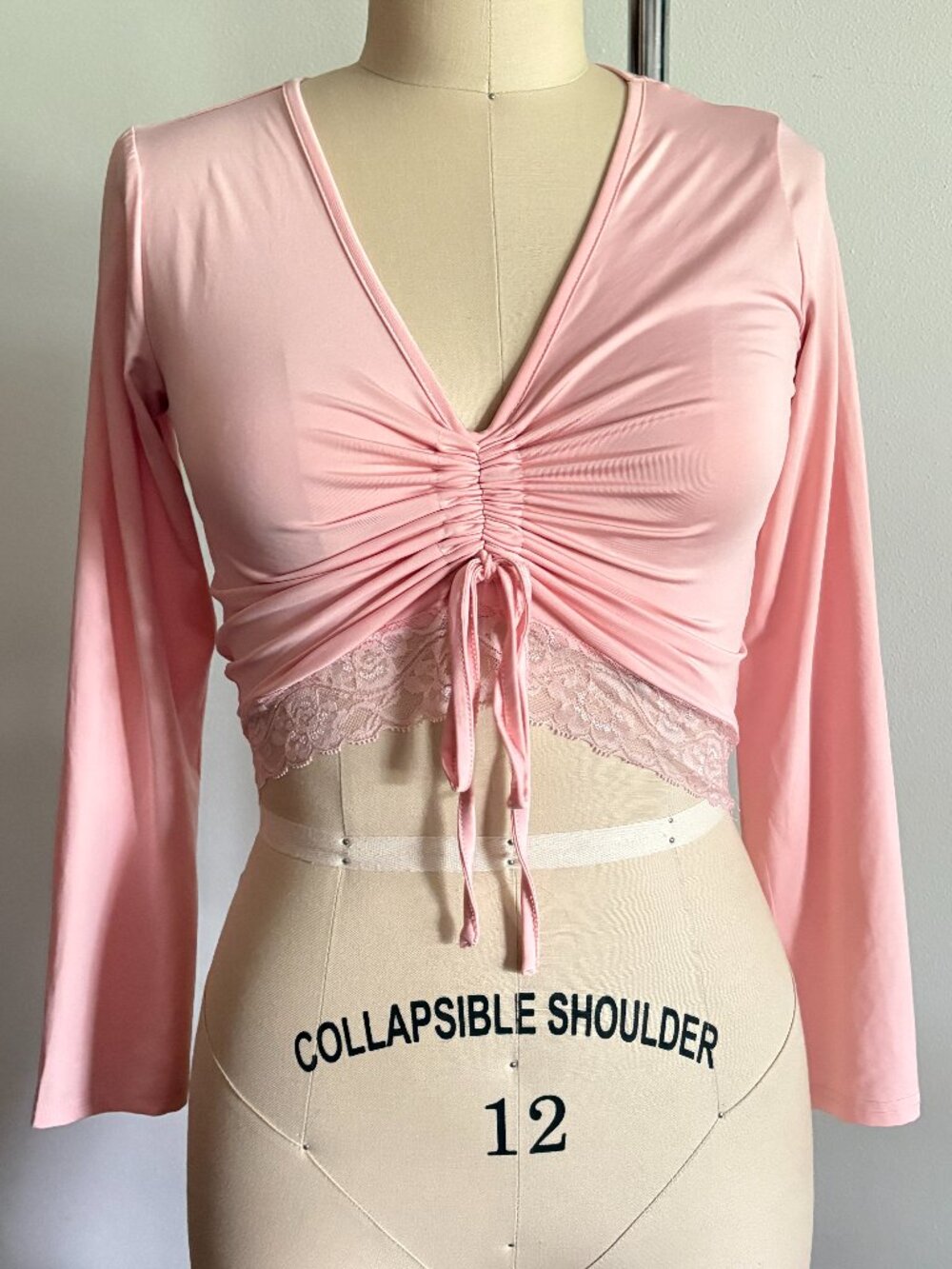 Pink Long-Sleeve Ruched Crop Top with Lace Trim Hem